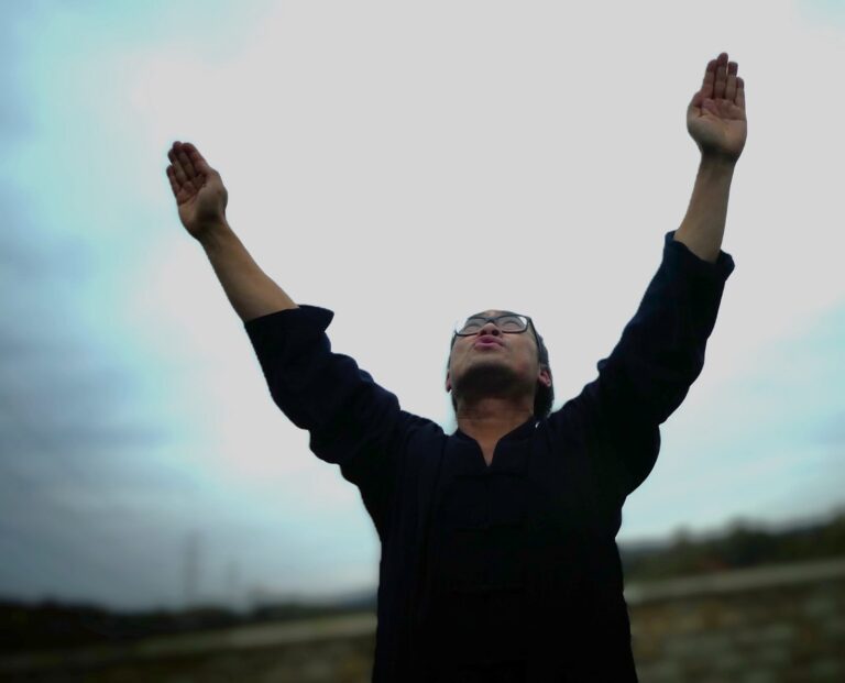 Student at Sea Cloud Hall practising Happy Days daoyin breathwork
